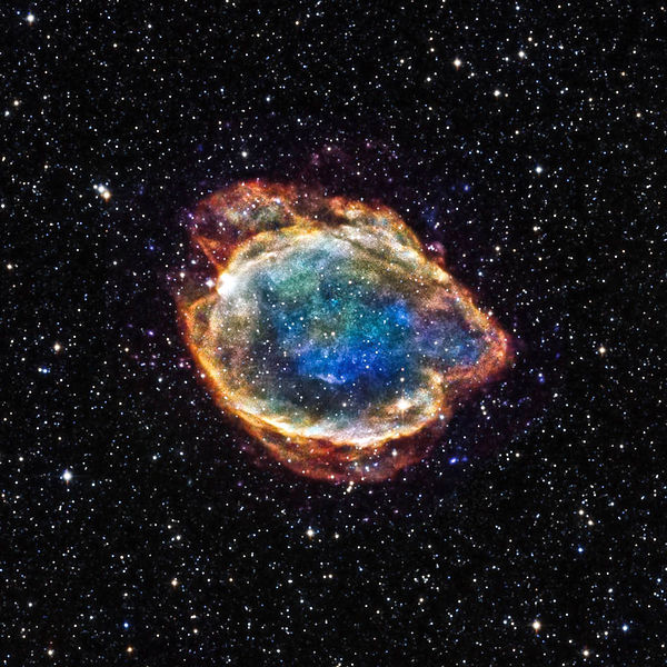 Image from Wiki Commons. Type 1a supernova remnant G299 as seen in X-ray light by NASA’s Chandra Observatory, superimposed on an infrared image of background stars.