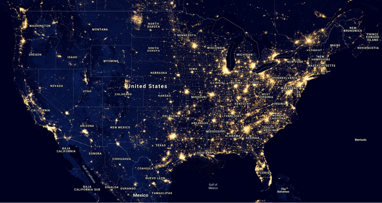 Satellite image of the United States at night, showing areas of high light concentration.